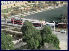 Views from Torres de Serranos 27 - red buses at one of the bridges above Turia Gardens